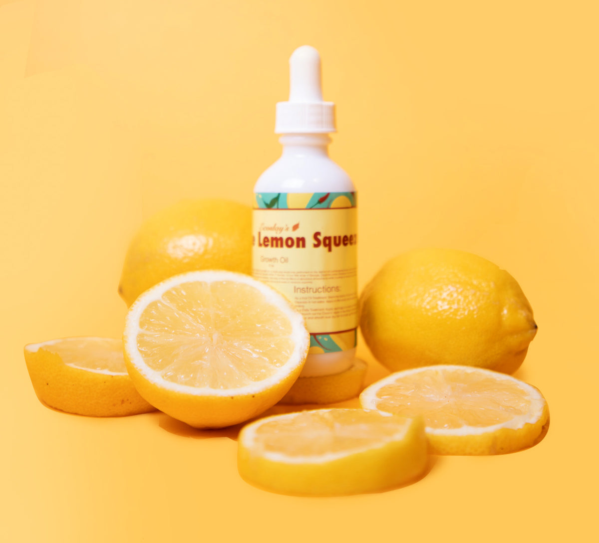 Cayenne Lemon Squeeze dropper bottle with fresh lemons